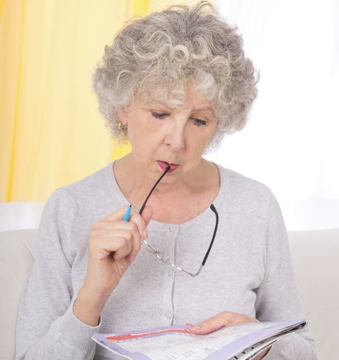 Senior woman doing arrow words